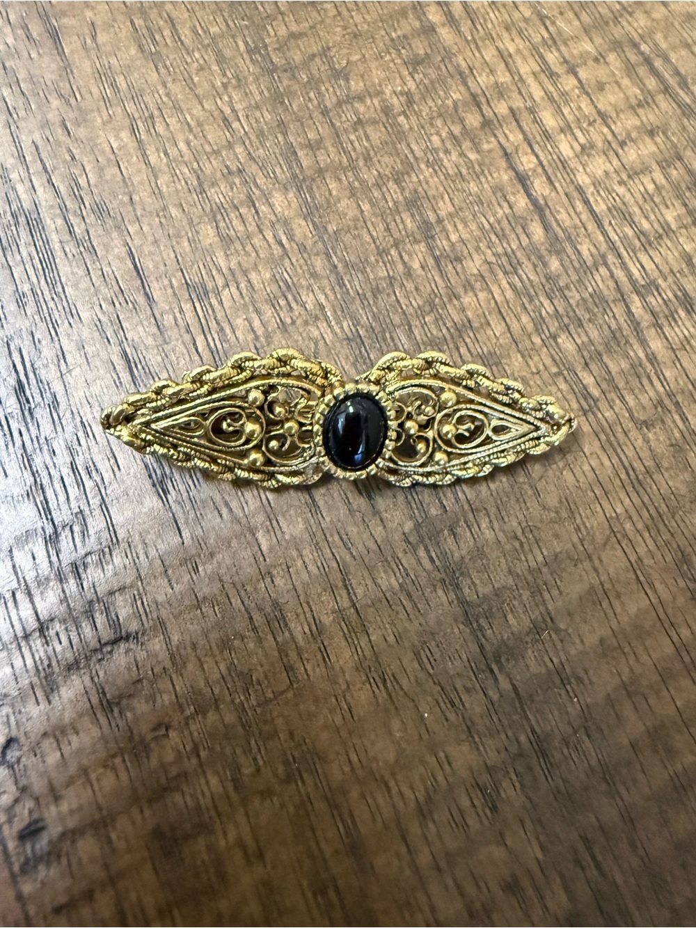 Gold Filigree Bar Brooch with Black Cabochon